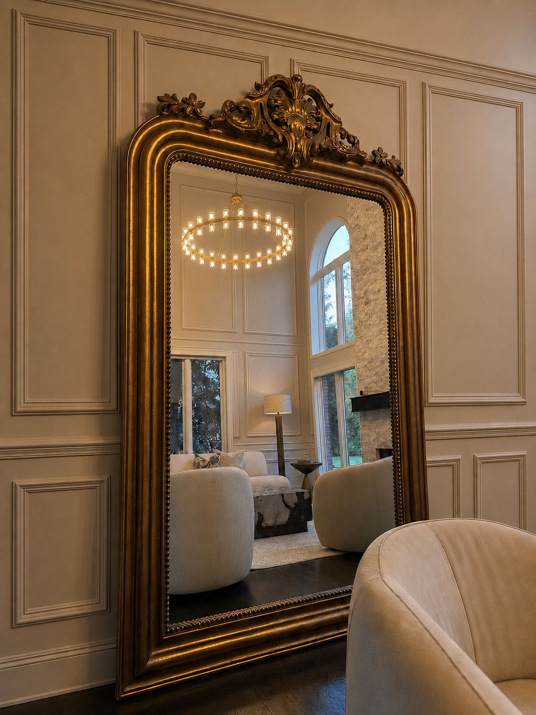 Interior design detail with ornate gold mirror and cream furnishings