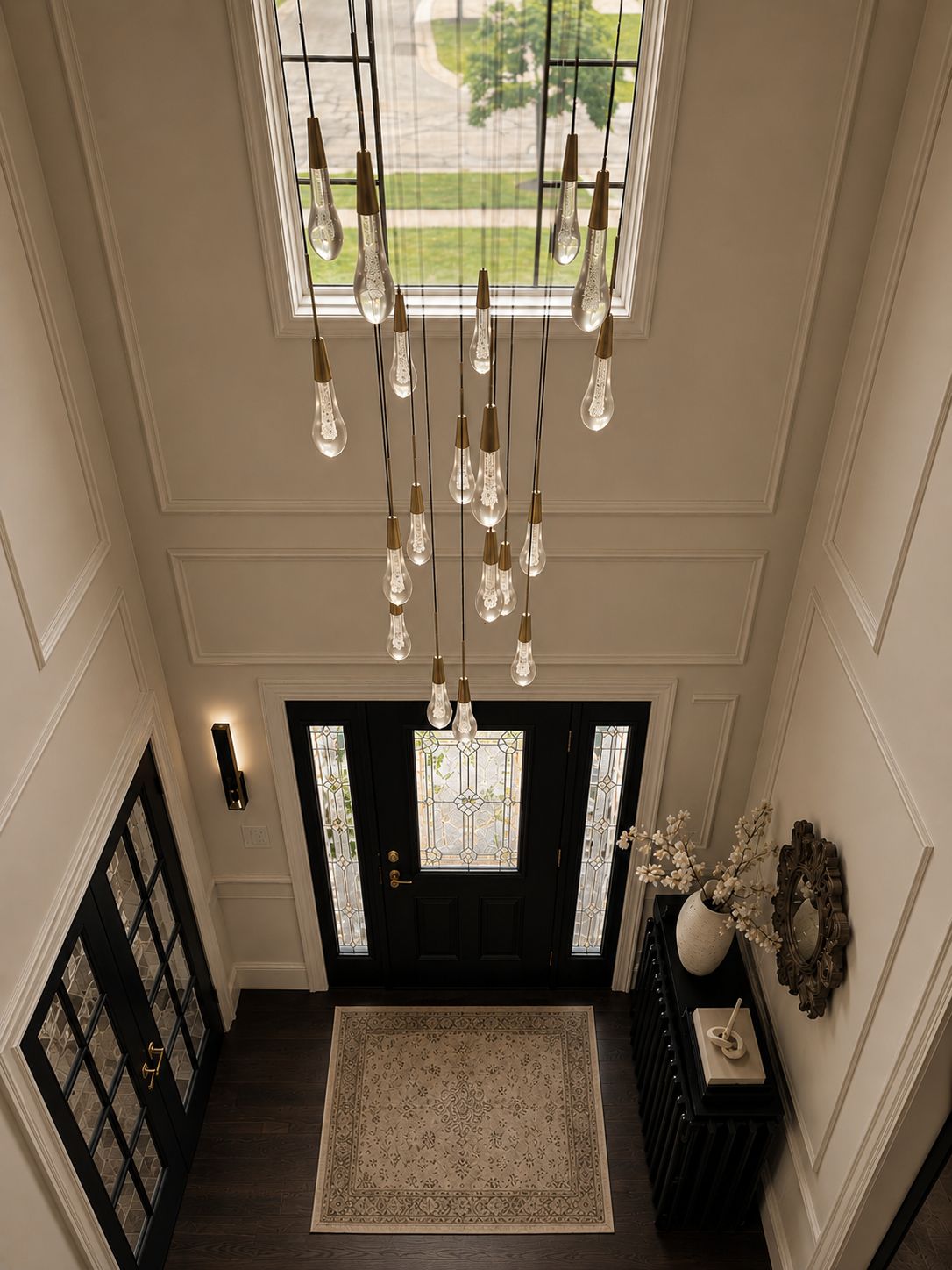 Grand two-story entryway with pendant lighting
