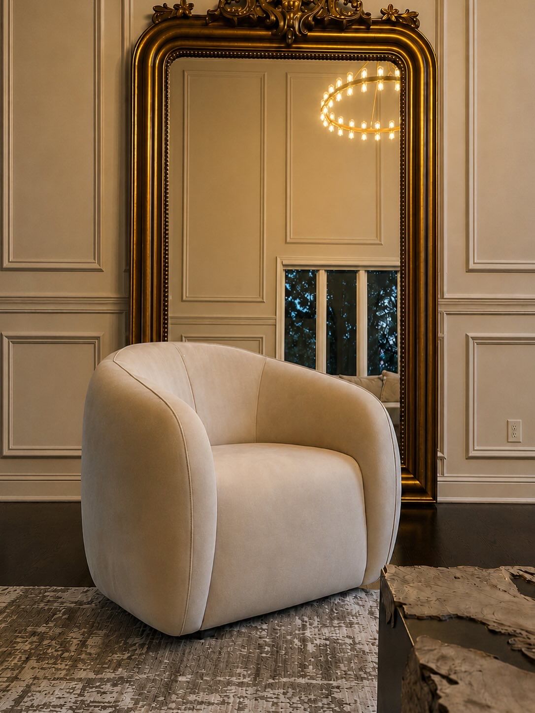 Cream accent chair with ornate gold mirror